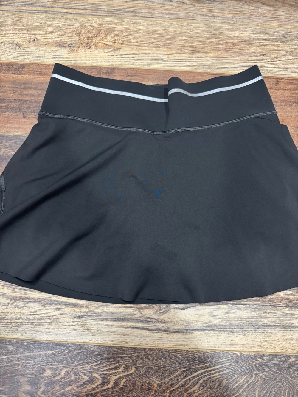 dark green Athleta Sonic Skort with Reflective Waistband